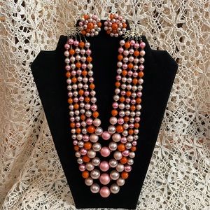 Vintage five tiered pink and orange necklace and earrings set.